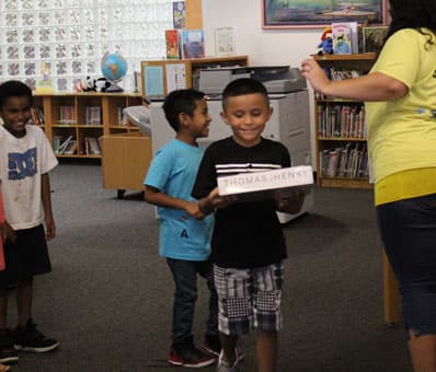 Children Receiving School Supplies